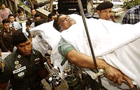 Alleged Indian gangster Vijay Daman being brought to a criminal court in Bangkok on Thursday .