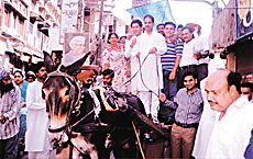 Youth Congress workers, led by District President Parminder Mehta, hold a demonstration to protest against the oil price hike.
