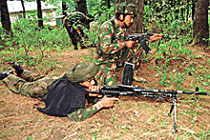 Troops take up positions during a gunbattle with militants in Nooradar Samthan in Bandipore, 57 km north of Srinagar, on Friday. The Army killed six militants of Pakistan-based Lashkar-e-Toiba in an encounter in the area