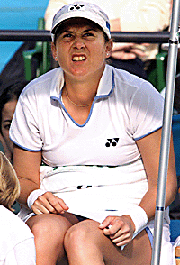 Monica Seles of the USA grimaces in pain as she gets a massage from a trainer during the second set of the semi-final of the women�s singles on Saturday.