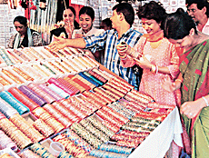 Mere haathon mein nau-nau chooriyan hain. Women and girls flock to a bangle shop in preparation for Karva Chauth, which falls on Monday.