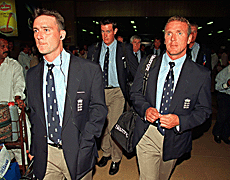 England team members walk out of the Quaid-e-Azam international airport, Karachi, as the 14-member squad arrives for 57-day tour on Monday. 