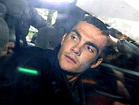 French cycling star Richard Virenque gets into a car Tuesday, October 24, 2000 as he leaves Lille's court.