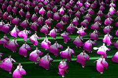 Hundreds of women dance for North Korean leader Kim Jong II and U.S. Secretary of State Madeleine Albright at a stadium in Pyongyang on Monday. Ms Albright, the first highest level U.S. official to visit North Korea in 50 years.