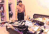 The owner of the house shows the scattered belongings in the room which was ransacked by thieves in Sector 12-A, Panchkula.