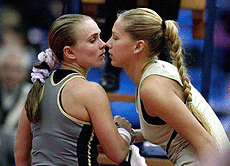 Russia's Anna Kournikova (right), kisses Russia's Tatiana Panova after their match at the Kremlin Cup Tennis Tournament in Moscow on Friday.