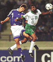 Japan�s Toshihiro Hattori (left) jumps for the ball against Saudi Arabia�s Talal al-Meshal during the final soccer game between Saudi Arabia and Japan for the Asian Cup 2000 in Beirut, Lebanon, on Sunday.
