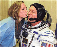 U.S. astronaut Bill Shepherd is kissed by his wife Beth before the launch from Baikonur on Tuesday �Reuters photo