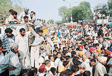 Irate truckers block the Chandigarh-Ambala highway at Dera Bassi on Thursday. 