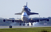The space shuttle Discovery lands at the Kennedy Space Centre in Florida on Friday. Riding piggyback atop the Boeing 747, Discovery left Edwards Air Force Base in California nine days after it landed at the military base in the Mojave Desert.