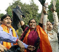 Demonstrators from a hardline Hindu group shout slogans as they try to disrupt a Press conference by Indian cricket star Ajay Jadeja in New Delhi.