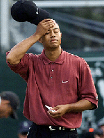 Defending champion Tiger Woods of Windemere, Florida, reacts at the 18th green after losing to Phil Mickelson in the final round of the Tour Championship at East Lake Golf Club in Atlanta, Georgia, on Sunday.