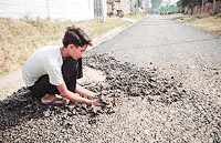 Carpeting work on this stretch of road in the extension area of the Industrial Focal Point of Phase IX was done on Tuesday.