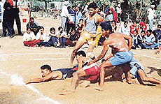 A tense moment during a kabaddi match at the Punjab State Rural Games in Sangrur.