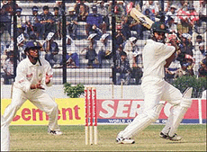 Bangladeshi batsman Habibul Bashar (right) plays a ball of India's Zaheer Khan as Sunil Joshi (left) looks on in Bangladesh's first ever Test match against India at Dhaka's Bangabandhu Stadium on Friday.