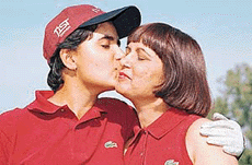 Irina Brar kisses her mother after winning the Punjab Ladies Open golf title in Chandigarh on Friday.