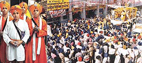 Children lead the nagar kirtan organised on the eve of the Gurpurb in Ludhians on Friday; (left) a view of the procession.