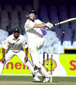 England's Mike Atherton hooks for a boundary off Pakistani pacer Abdul Razzak on the first day of the first Test in Lahore on Wednesday. England, who have already lost a series of three one-day matches against Pakistan, were 76 without loss at lunch.