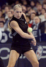 Anna Kournikova from Russia hits a backhand return to Jennifer Capriati of the USA during their first round match at the Chase Championships of the WTA Tour at New York's Madison Square Garden on Tuesday. Kournikova won the match 6-4, 6-4.