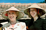 US First Lady Hillary Clinton and daughter Chelsea wear traditional hats during a visit to Phu Tang village outside Hanoi on Friday.