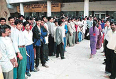 Citizens wait for their turn outside the CITCO office in Sector 17, for submitting application forms for voters� identity cards.