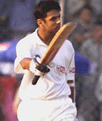 Rahul Dravid acknowledges cheers after completing his century on the third day's play of the first cricket test match between India and Zimababwe at Ferozeshah Kotla in New Delhi on Monday.