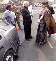 Cine star and member of Parliament Shabana Azmi arguing with a securityman after her car was hit by another vehicle at Parliament House in New Delhi on Wednesday. 