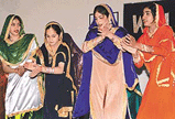 Students of the Government Girls Secondary School, Sector 33, present giddha at the Cultural Unity Day celebrations in Chandigarh.