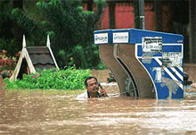 Lance Corporal Shamsuddin Jusoh checks a phone line in Besut