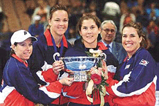 The US Federation Cup team-members pose with the 2000 Federation Cup on Saturday at the Mandalay Bay Event Center in Las Vegas. From left: Lisa Raymond, Lindsay Davenport, Monica Seles and Jennifer Capriati. The USA swept Spain in the finals 5-0 for their second consecutive cup.