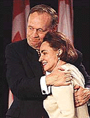 Prime Minister Jean Chretien hugs his wife Aline