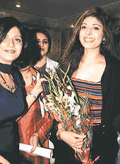Film actress Pooja Batra clutches a bouquet as she enters VLCC, Sector 8, to open a beauty carnival on Thursday.