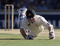 Australian opening batsman Michael Slater dives back into his crease during his innings of 19 on the first day of the second cricket test in Perth.