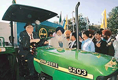 Lt-Gen J.F.R. Jacob (retd) tries his hand at a model of a tractor at Agro-Tech 2000 in Chandigarh on Friday.