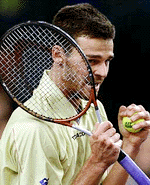 Gustavo Kuerten of Brazil reacts after scoring the winning point to beat Pete Sampras of the USA in their semifinals match for the $3.7 million season-ending ATP Masters Cup in Lisbon on Saturday. 