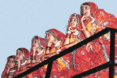 Girls watch from a balcony a dance competition held in Government Polytechnic, Sector 10, Chandigarh.