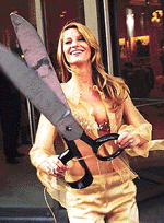 Brazilian supermodel Gisele Bundchen, wearing a Victoria's secret jewelled Fantasy Bra encrusted with Thai rubies, semiprecious stones and diamonds, reacts after a ribbon-cutting ceremony for a Victoria's Secret lingerie store on Thursday in New York.  