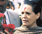 Congress president Sonia Gandhi receives a bouquet from her well-wishers on her 55th birthday at her residence in New Delhi on Saturday.