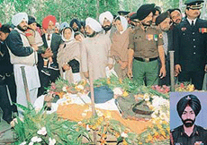 Relatives file past Major Manwinder�s body.