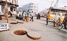 DUCT HOLE OR DEATH TRAP: Even the death of a kid after falling in a manhole has not forced the Telecom Department to put up a �caution� or �work in progress� sign near these duct holes on a road in Ludhiana.