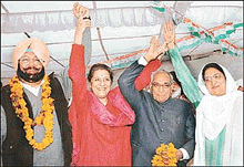 Capt Amarinder Singh waves to his supporters along with Ms Ambika Soni, Mr Moti Lal Vora and Mrs Rajinder Kaur Bhattal after taking over as Punjab Congress Committee chief in Chandigarh on Saturday.