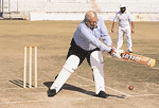 The Punjab Governor, Lieut-Gen J.F.R. Jacob (retd), tries his hand on the bat during the cricket match between a Patern-in-chief PCA XI and Army Commander XI at PCA Stadium in SAS Nagar.