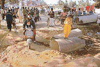 The dug-up road leading to the Mansa Devi shrine which has become a problem for the public. 