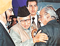 Abdullah Mallik, who has come here from Pakistan, hugs Mr Inder Kumar Gujral, a former Prime Minister of India, at the World Punjabi Conference in Chandigarh on Saturday.