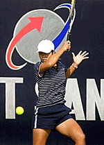 Li Na of China returns a shot to Thailand's Suchanan Viratprasert during their women's singles round robin match of the Asia Cup Tennis Tournament in New Delhi on Saturday. Li won the match 6-2, 6-0.