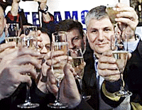Democratic Opposition of Serbia candidate for Prime Minister Zoran Djindjic (centre) toasts his victory with other party leaders in Belgrade on Sunday.