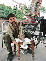 A cane-weaver at work.