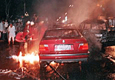 Indonesian firemen estinguish a burning car after a bomb blast outside a Catholic school in Jakarta on Sunday. 