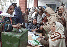 A Pakistani woman casts her vote at a polling station in a village in Bhalwal district, about 160 km south of the capital, Islamabad, on Sunday.