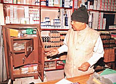 Mr Khem Gupta shows the broken safe in his Sector 18 shop from where Rs 7 lakh was stolen on Monday night.